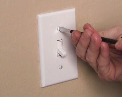 Fasten the wall plate on top of the switch